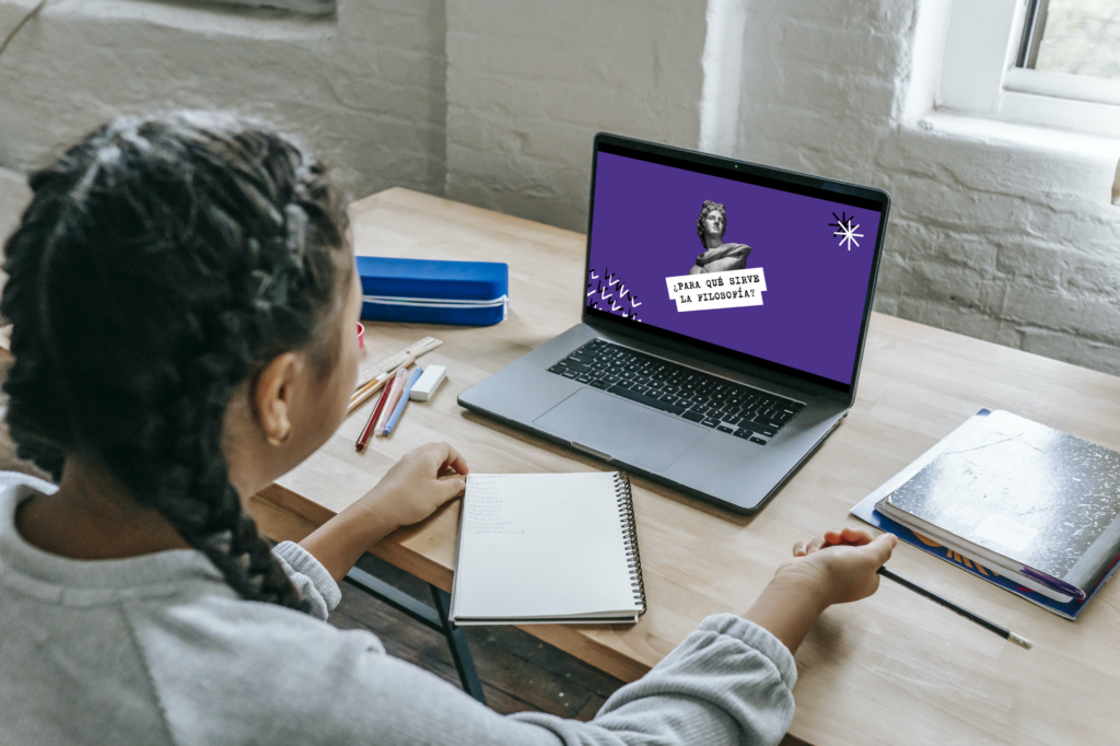 african american girl taking online classes on macbook pro 1